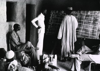 Village health workers attending a course on primary health care in Torodi, Niger. The teacher is a qualified male nurse. The new emphasis on training primary health workers stems from the realization that simply providing more physicians and more nurses will not solve the health problems of devloping countries