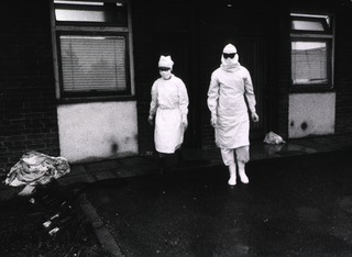 Personnel in the emergency smallpox hospitals wear protective clothing