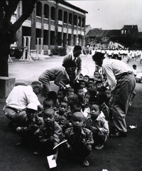 ... children at a school in Taipeh, Taiwan (China) line up for vaccination