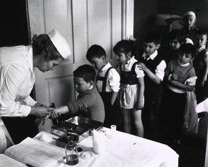 Six-year-old children attend the dispensary for the second vaccination that protects them against the TB bacillus