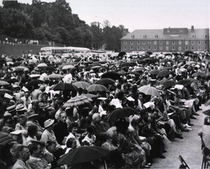 [The audience arranges umbrellas during the dedication ceremonies of the Clinical Center]