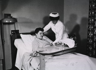 [Nurse with patient in the Clinical Center]