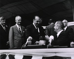 [President Lyndon Johnson greets Anthony Celebrezze at the ceremony for the signing of the Health Research Facilities Act]