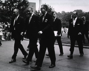 [President Lyndon Johnson walking with William H. Stewart and James A. Shannon]