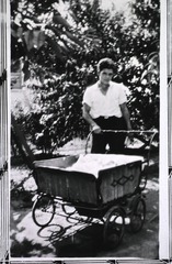 [Young man, son of a leper, with a baby carriage]