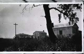 [Panoramic view showing three buildings]