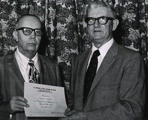 [George H. Brockelbank receives a Special Achievement Award, presented by James W. Schriver]