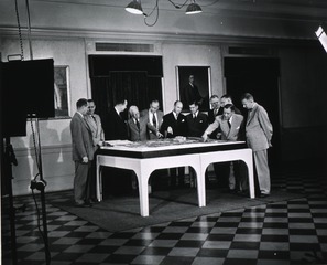 [Dr. Rolla Dyer and others inspect model of NIH campus]