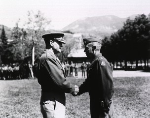 Lieutenant General Lucian K. Truscott, Jr., CG of the Fifth Army, congratulates Lt. Col. Howard E. Snyder (Winfield, Kan.) after awarding him the Legion of Merit