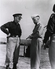 Lt. General Lucian K. Truscott, CG, U.S. Fifth Army, and Brig. General Francis H. Oxx, CG, Peninsular Base Section, talk after Presidental Citations were awarded to the 442nd Infantry Regiment, Leghorn, Italy, 9/4/[19]45