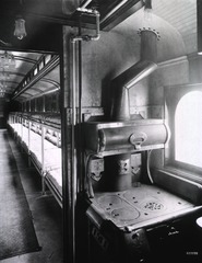 [Interior view of a hospital train patient car and kitchen area]
