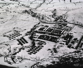 [Aerial view of the 8th Evacuation Hospital and snow-covered countryside]
