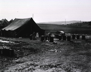 [View of barrels for washing mess gear, 95th Evacuation Hospital]
