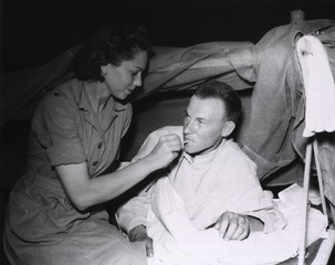 [Nurse taking the temperature of a patient, 95th Evacuation Hospital]