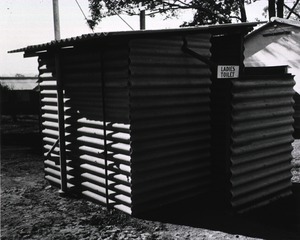 [View of the small metal structure housing the women's lavatory of the 118th General Hospital, Herne Bay, N.S.W.]