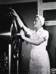 [Army nurse operating an autoclave]