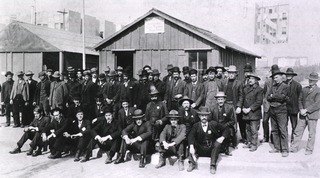 [Group portrait of public health service workers (?) standing in front of the United States Public Health Marine Hospital Service Headquarters, Fourth Provisional Plague District, San Francisco, Calif.]