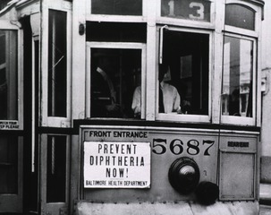 [Prevent Diphtheria Now!]: [Close-up of sign on Trolley No. 5687]