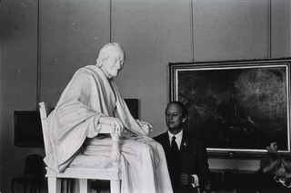 [Donald S. Fredrickson with statue of Voltaire]