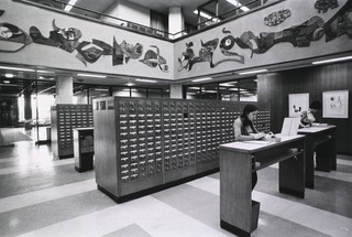 [Two women using the card catalog in the rotunda]