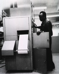 [Frank Shifflett adjusting the Haloid Xerox machine]