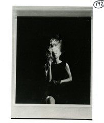 [A woman smoking a cigarette]