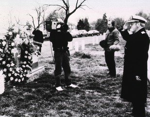 Surgeon General C. Everett Koop salutes the grave of the late Surgeon General Luther Terry