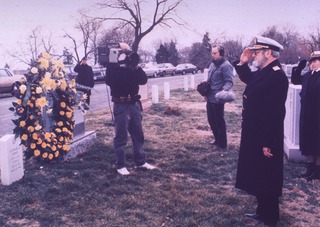 Surgeon General C. Everett Koop salutes the grave of the late Surgeon General Luther Terry
