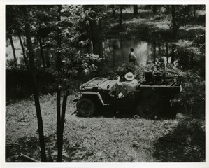 Larvicide spraying from a jeep