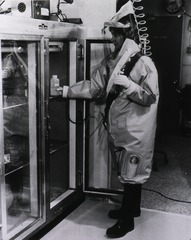 [Woman in a contamination suit]