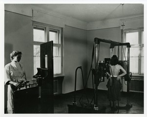 [A woman getting X-rayed for tuberculosis in a U.S. quarantine office in Berlin, Germany, to see if she is eligible for a visa to enter the United States]