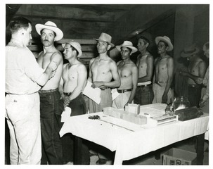 Public Health Service officer vaccinating Mexican migrant workers in El Paso, Texas