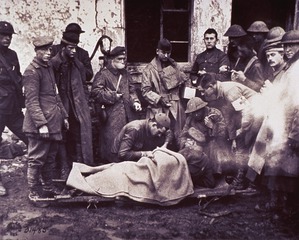... administering to wounded German officer, 89th Division dressing station, near Remonville, November 2, 1918