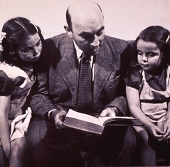 [Man reading to children]