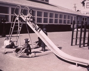 [Children and the sliding board]