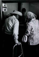 [Elderly man and woman at reception desk of the Martin Clinic, Martin, South Dakota]