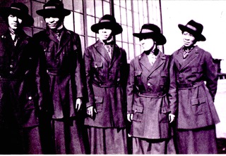 [Portrait of five African American female nurses in uniform, circa 1920]