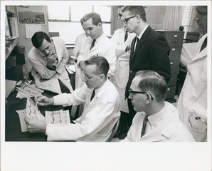 Victor McKusick with genetics fellows examining phonocardiographic findings