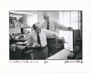 Daniel Nathans and Hamilton Smith demonstrating images of restriction fragments to television reporters after receiving the Nobel Prize