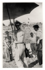 Linus Pauling with sunglasses holding beach umbrella