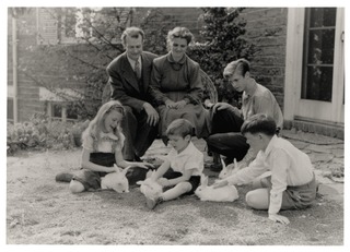The Pauling family playing with rabbits