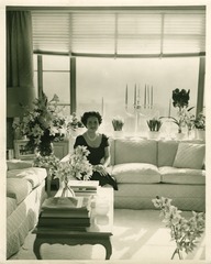 Mary Lasker on her living room sofa