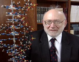 Dr. Lederberg with model of DNA