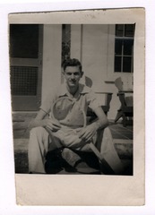 Marshall Nirenberg sitting on porch, age 20