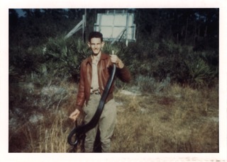 Marshall Nirenberg holding snake, age 16