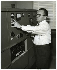 Sol Spiegelman adjusting laboratory equipment