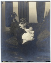Mrs. Dennis holding infant Clarence