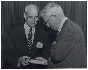 Clarence Dennis being given bound volume of 1987's Forum on Fundamental Surgical Problems dedicated to him