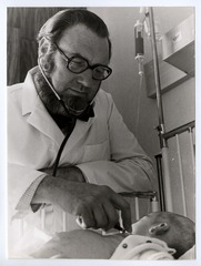 C. Everett Koop examining an infant