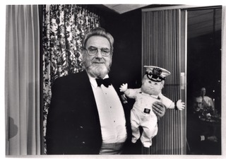 C. Everett Koop holding a doll in his likeness